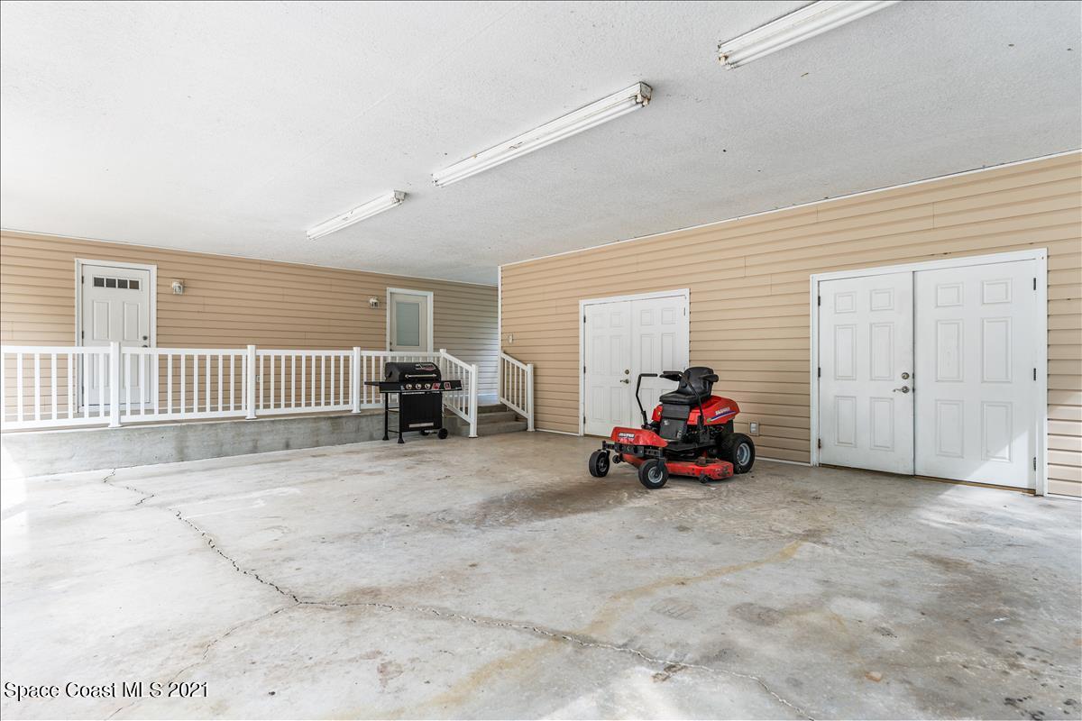 1120 Reed Grove Road Oak Hill, FL 32759 - Photo 35 of 40 carport