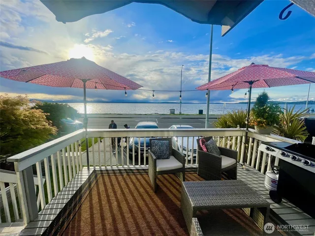 an outdoor view of patio with umbrella