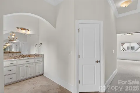 a room with a sink and a mirror