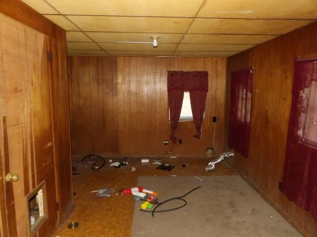 an empty room with a mirror