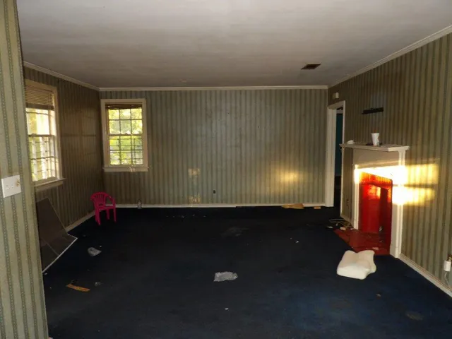 a view of a livingroom with furniture and a window