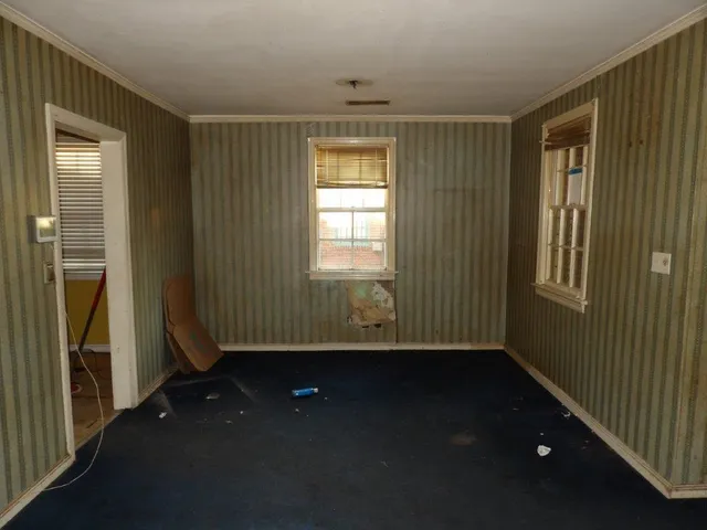a view of an empty room with a window