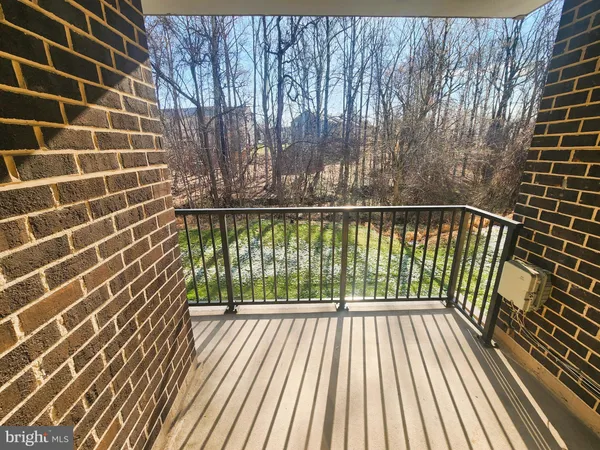 a view of balcony with wooden floor