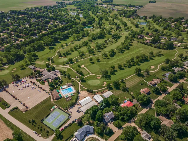 an aerial view of a residential houses with outdoor space