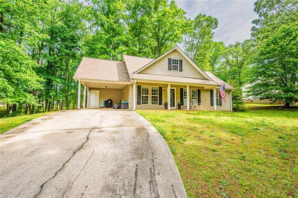 a front view of a house with a yard