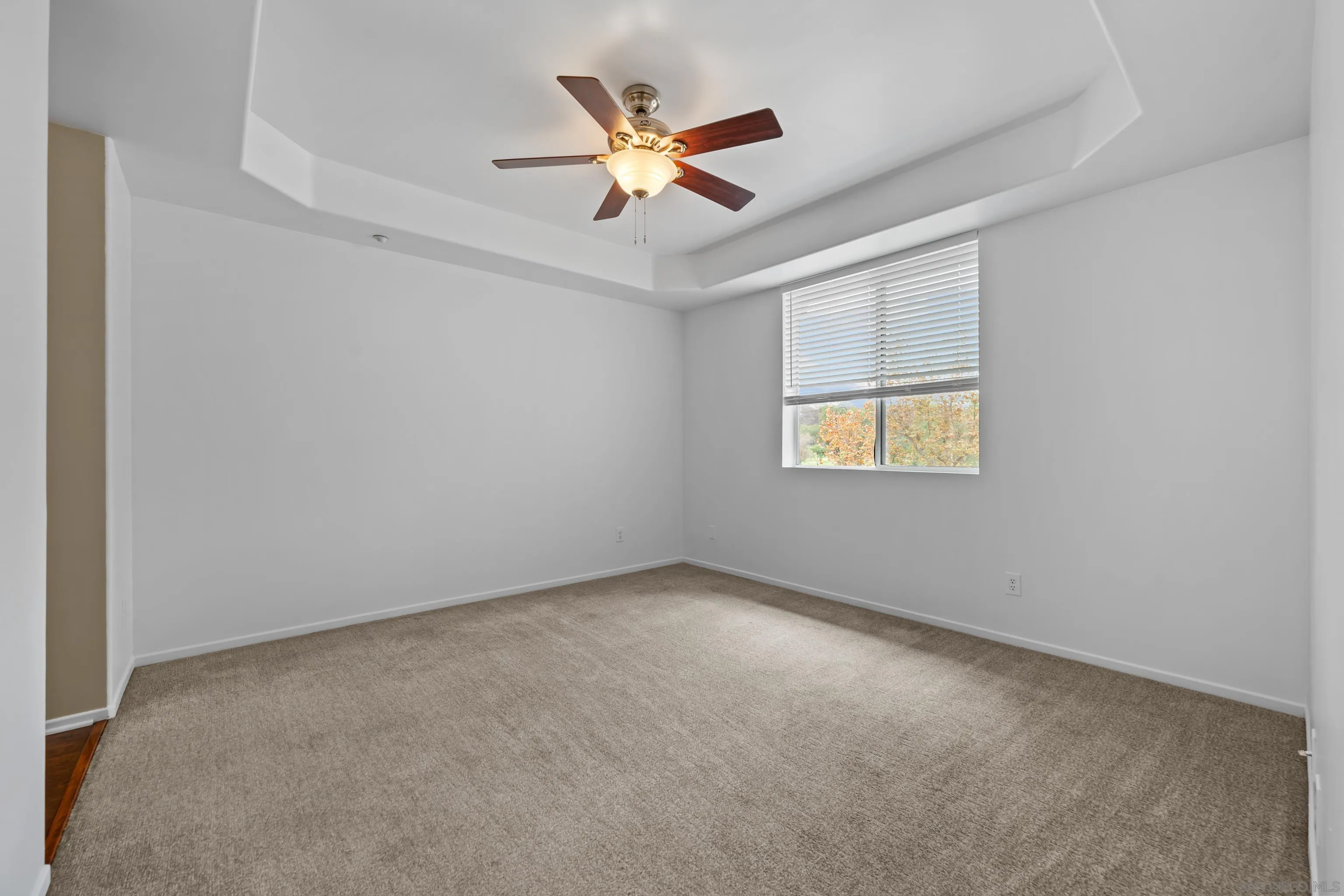 3267 Dehesa Road, Unit 69 El Cajon, CA 92019 - Photo 18 of 34 an empty room with a ceiling fan and window