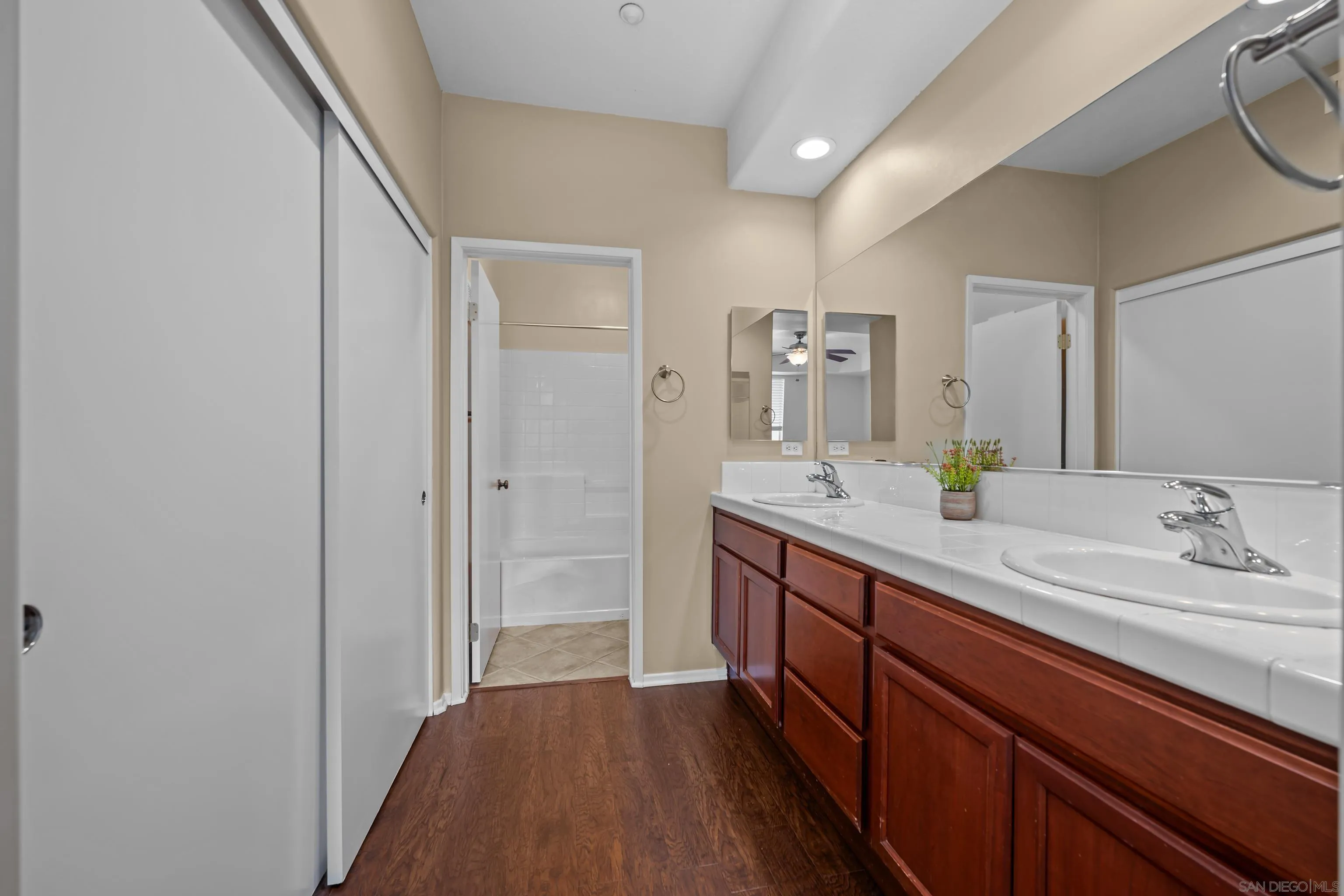 3267 Dehesa Road, Unit 69 El Cajon, CA 92019 - Photo 19 of 34 a spacious bathroom with a double vanity sink and a mirror