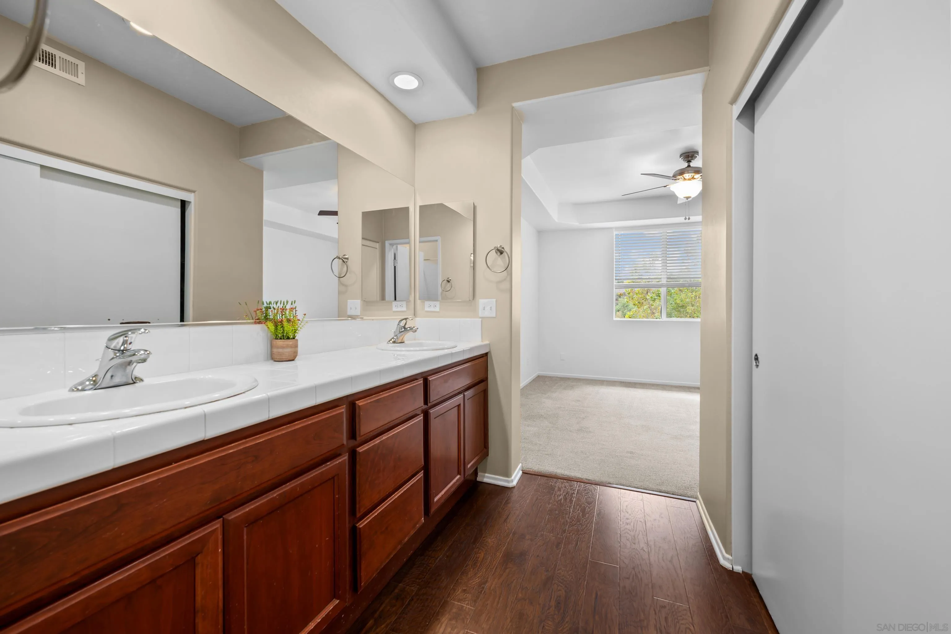 3267 Dehesa Road, Unit 69 El Cajon, CA 92019 - Photo 20 of 34 a spacious bathroom with a granite countertop sink and a mirror