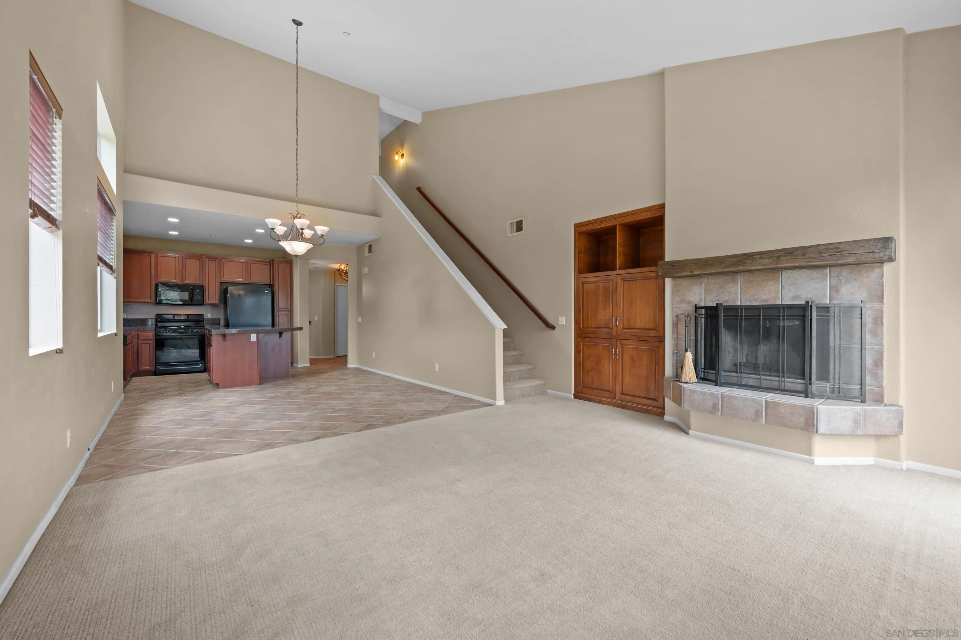 3267 Dehesa Road, Unit 69 El Cajon, CA 92019 - Photo 2 of 34 an empty room with furniture and a fireplace