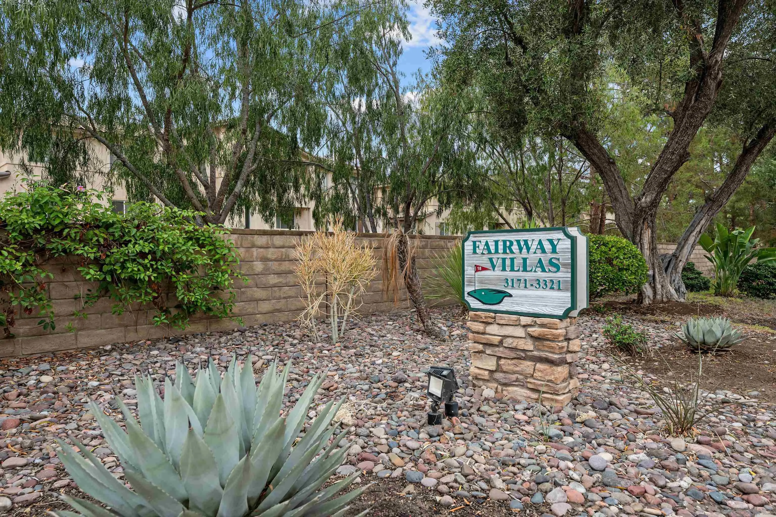 3267 Dehesa Road, Unit 69 El Cajon, CA 92019 - Photo 30 of 34 a sign board with a bench in a garden