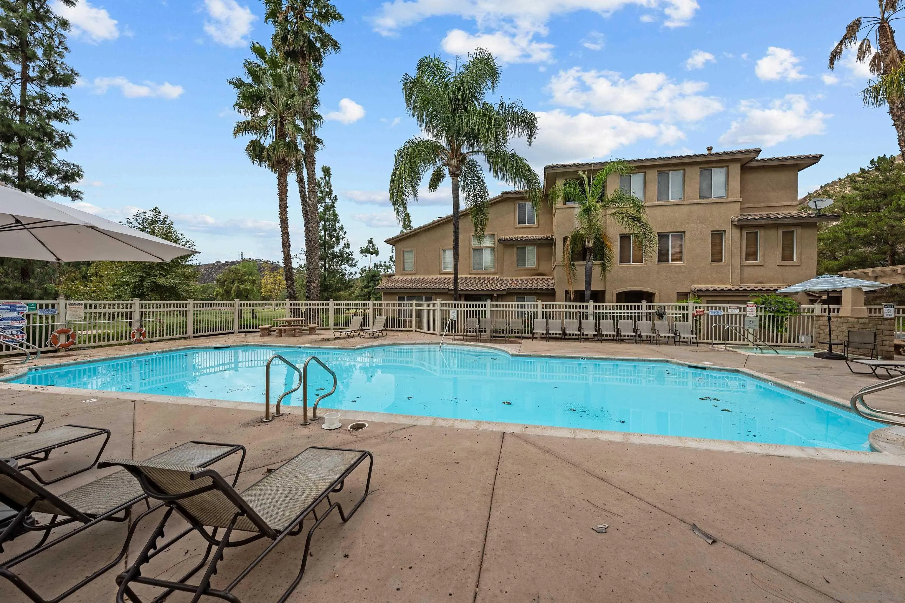 3267 Dehesa Road, Unit 69 El Cajon, CA 92019 - Photo 32 of 34 a view of backyard with swimming pool and seating space
