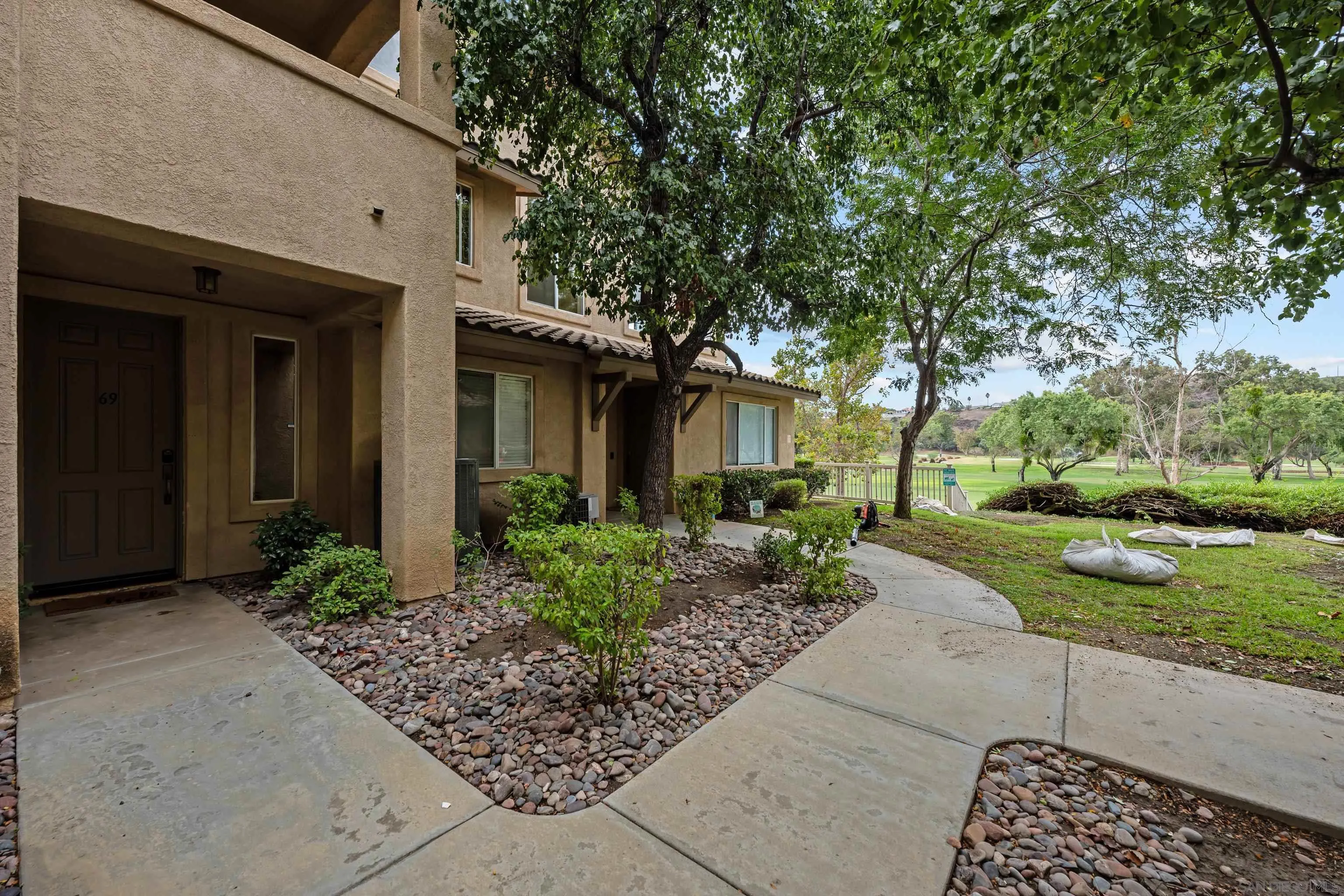 3267 Dehesa Road, Unit 69 El Cajon, CA 92019 - Photo 6 of 34 a front view of a house with garden