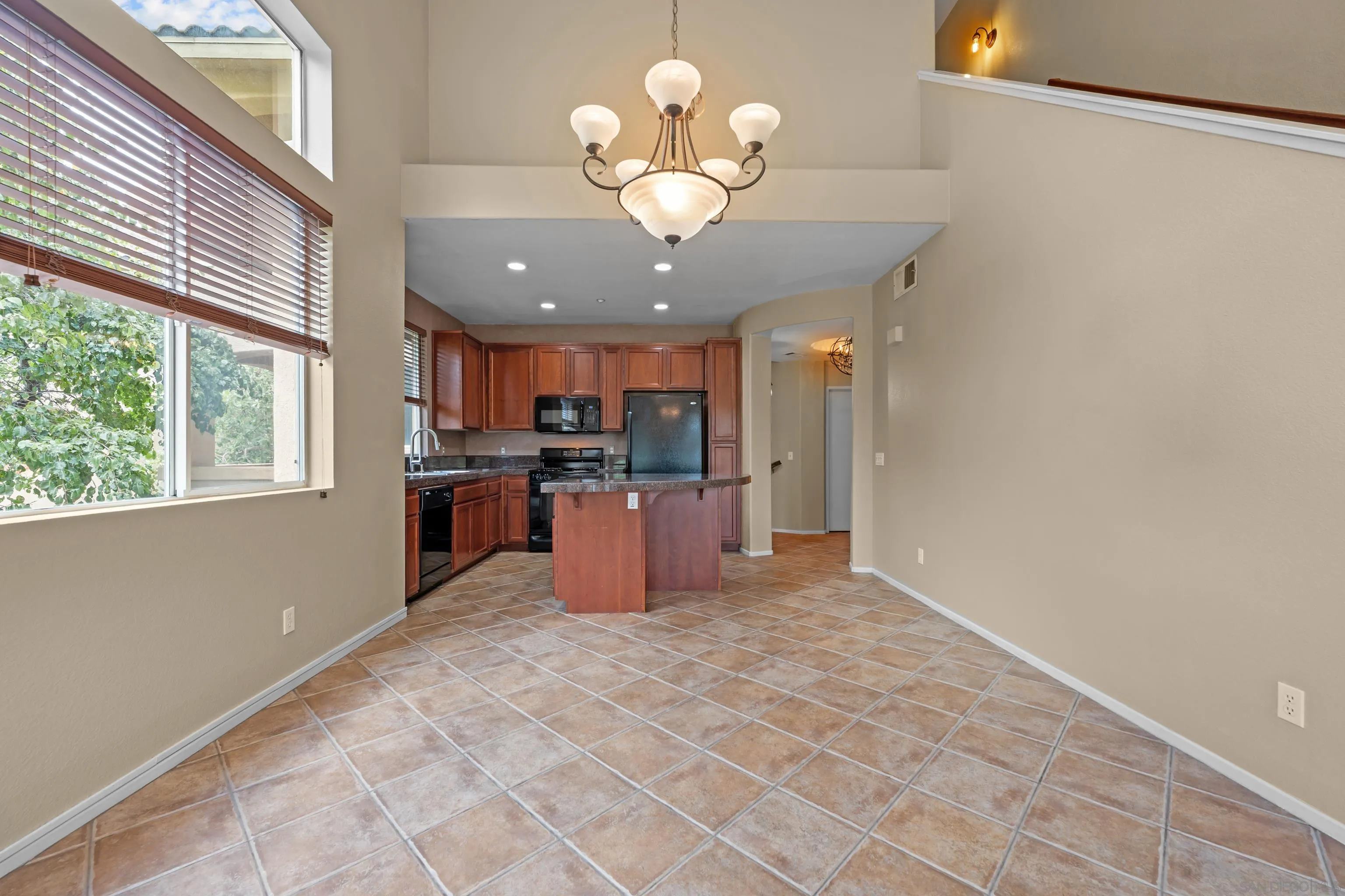 3267 Dehesa Road, Unit 69 El Cajon, CA 92019 - Photo 9 of 34 a view of a kitchen with a sink stainless steel appliances and cabinets