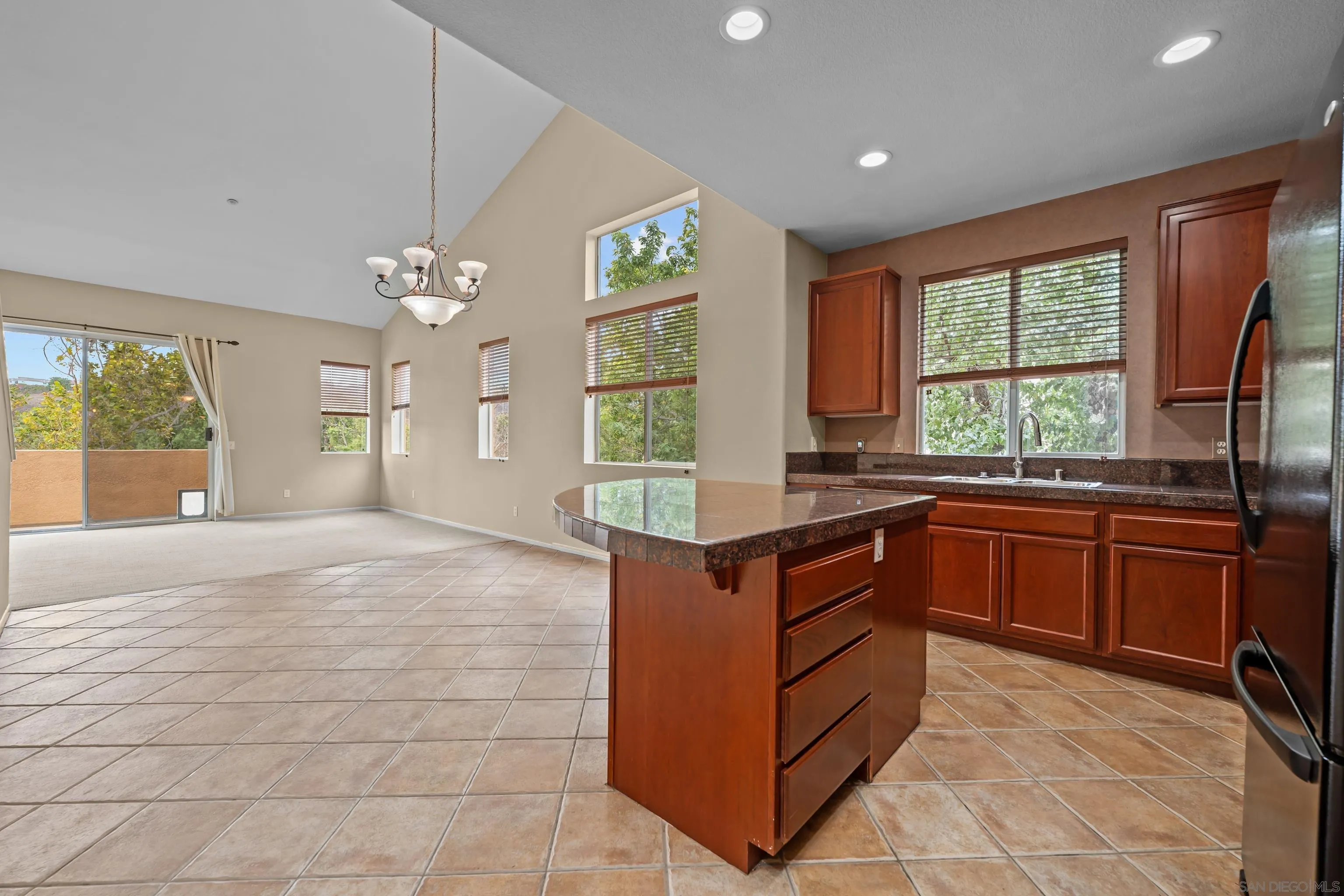 3267 Dehesa Road, Unit 69 El Cajon, CA 92019 - Photo 10 of 34 a kitchen with stainless steel appliances granite countertop a stove and a sink