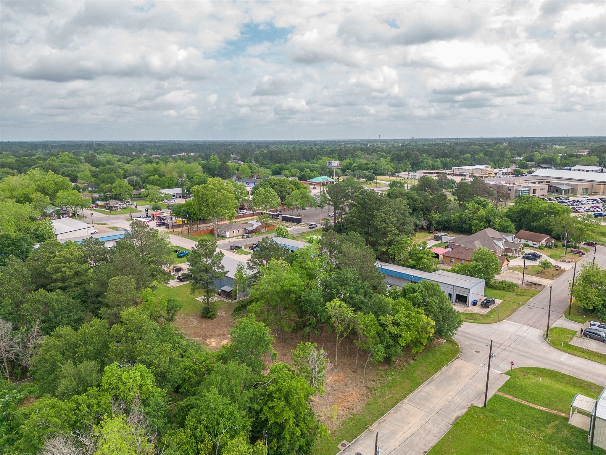 Tbd Mechanic Street Tomball, TX 77375 - Photo 11 of 24 a view of a city with lawn chairs and large trees