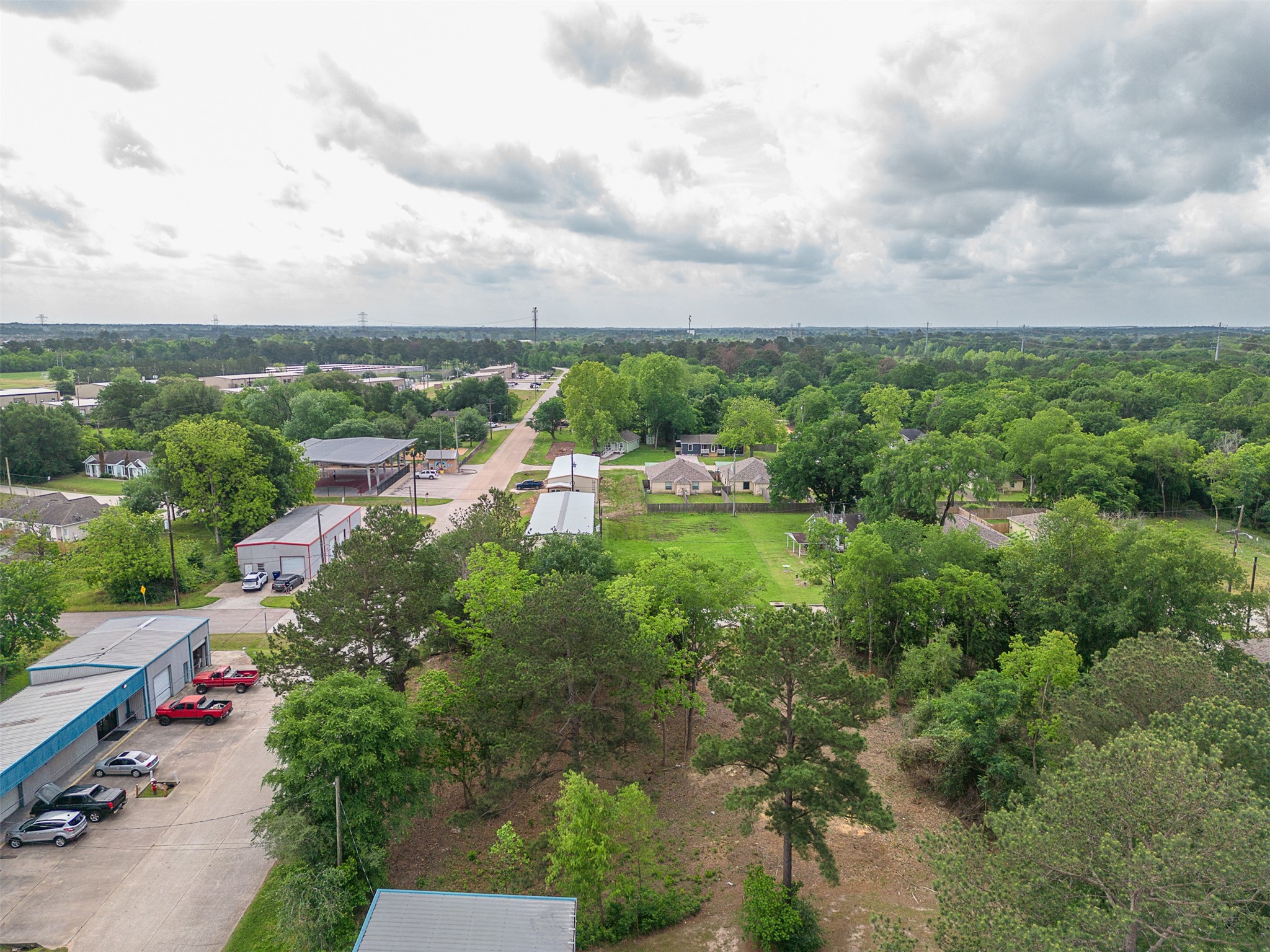 Tbd Mechanic Street Tomball, TX 77375 - Photo 8 of 24 an aerial view of residential house with outdoor space and trees all around