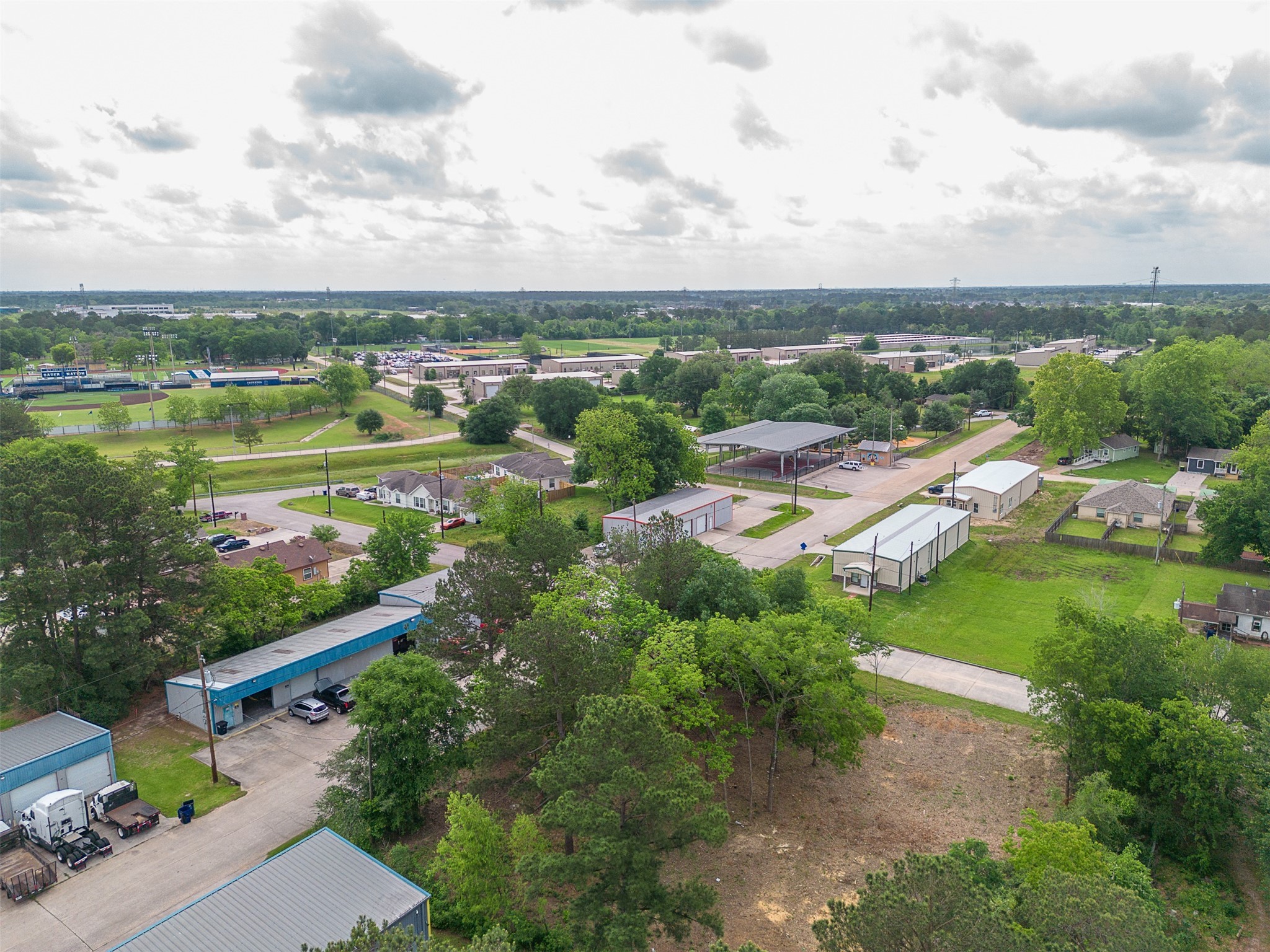 Tbd Mechanic Street Tomball, TX 77375 - Photo 9 of 24 an aerial view of lake residential house with outdoor space and trees