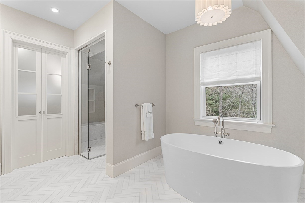 168 Beaver Road Weston, MA 02493 - Photo 13 of 27 a bathroom with a bathtub and a shower