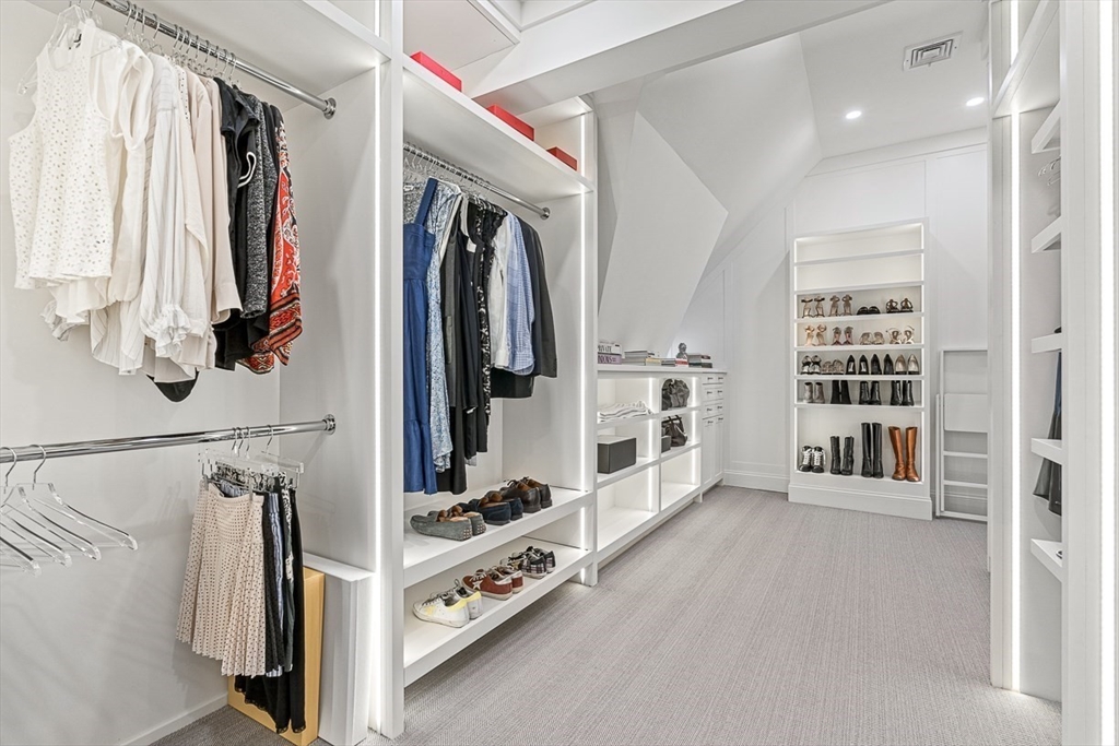 168 Beaver Road Weston, MA 02493 - Photo 15 of 27 a view of walk in closet with clothes and shoes