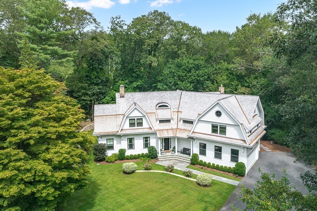 168 Beaver Road Weston, MA 02493 - Photo 2 of 27 a view of a white house with a yard potted plants and large tree