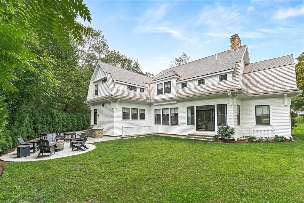 168 Beaver Road Weston, MA 02493 - Photo 21 of 27 a view of a house with backyard porch and patio
