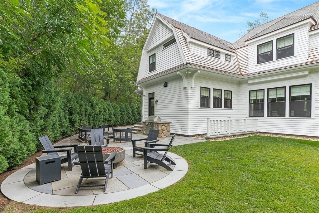 168 Beaver Road Weston, MA 02493 - Photo 22 of 27 a view of a house with backyard sitting area and swimming pool