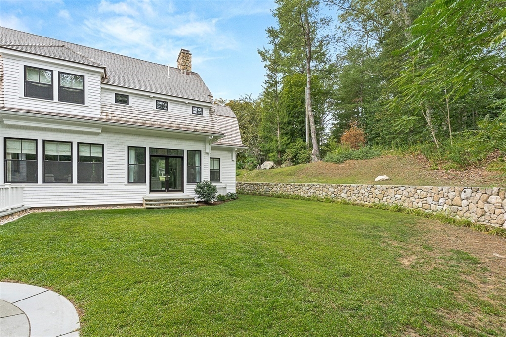 168 Beaver Road Weston, MA 02493 - Photo 24 of 27 a front view of a house with a yard