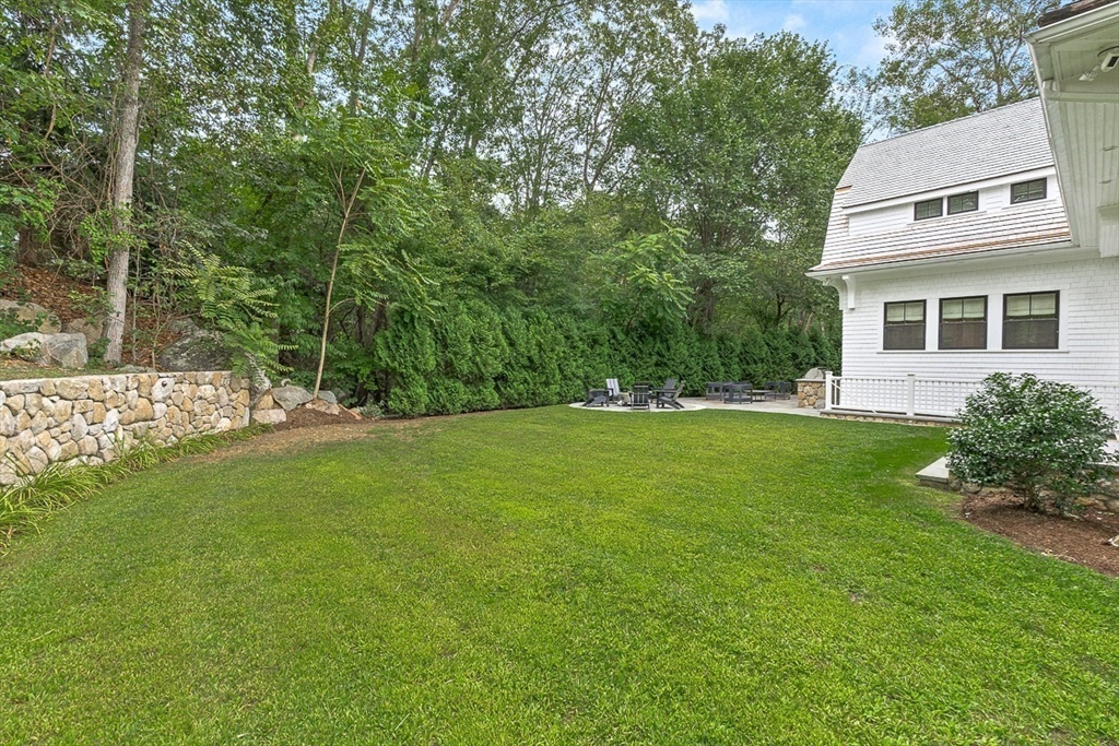 168 Beaver Road Weston, MA 02493 - Photo 25 of 27 a view of a house with a yard