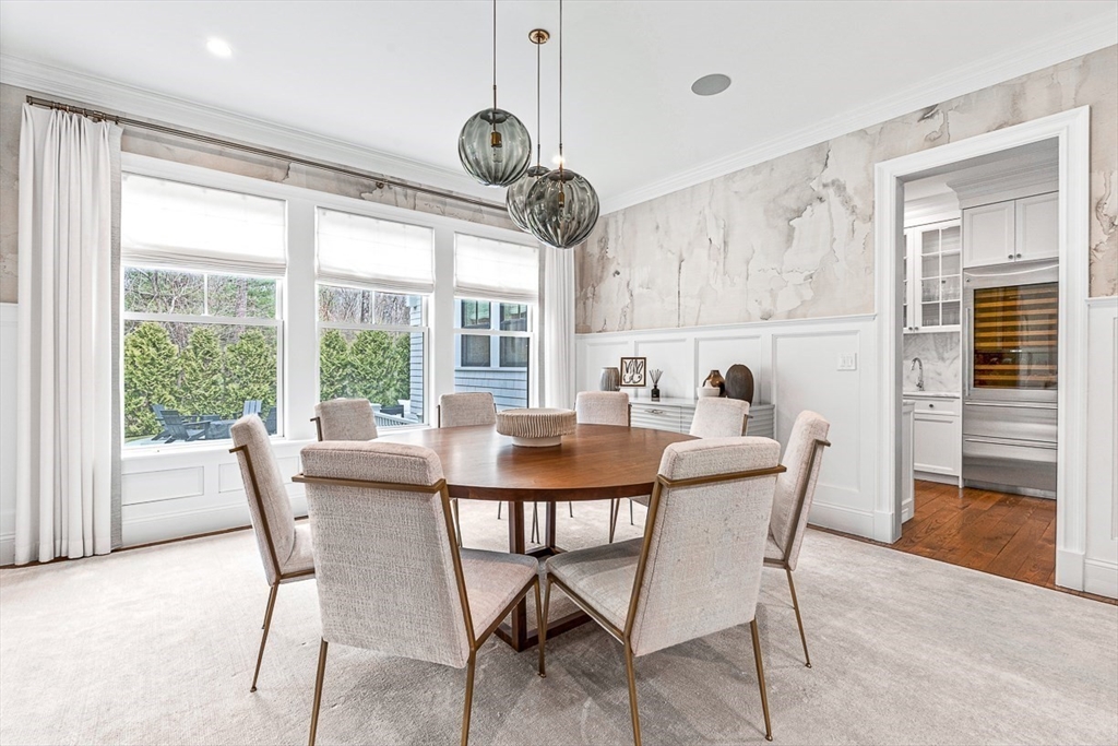 168 Beaver Road Weston, MA 02493 - Photo 6 of 27 a dining room with furniture a chandelier and wooden floor