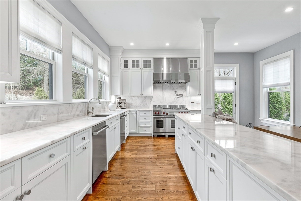 168 Beaver Road Weston, MA 02493 - Photo 7 of 27 a large kitchen with stainless steel appliances lots of counter space a sink and a large window