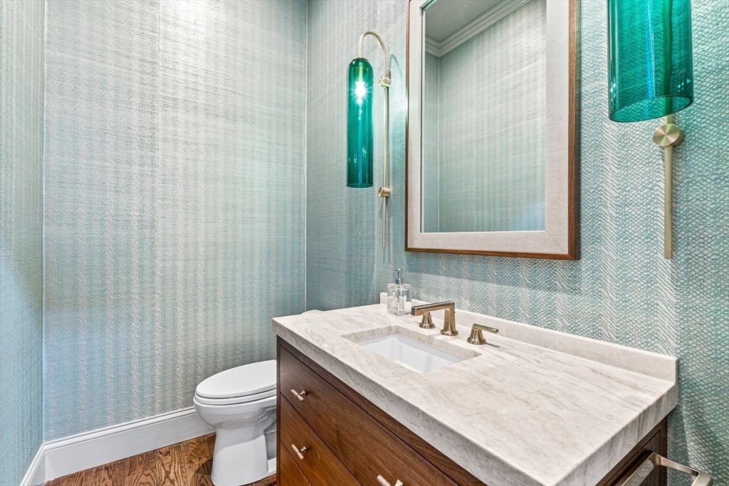 168 Beaver Road Weston, MA 02493 - Photo 10 of 27 a bathroom with a granite countertop sink a toilet and mirror