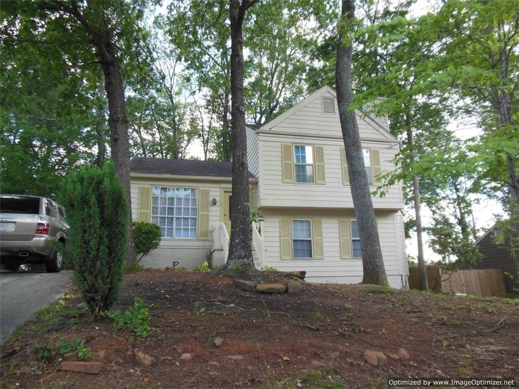 1983 Valley Ridge Lane Duluth, GA 30096 - Photo 1 of 1 a front view of a house with a garden