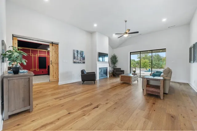 a view of a livingroom with furniture window and wooden floor