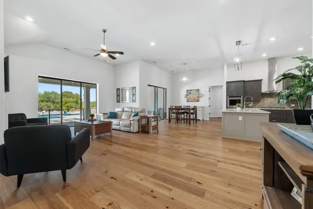 a living room with fireplace furniture and a flat screen tv