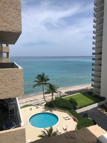 a view of a swimming pool with a patio