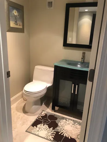 a bathroom with a toilet and a sink
