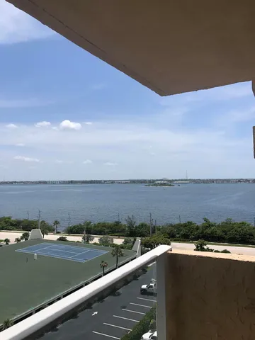 a view of a lake with houses in the back