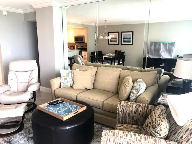 a living room with furniture and a lamp