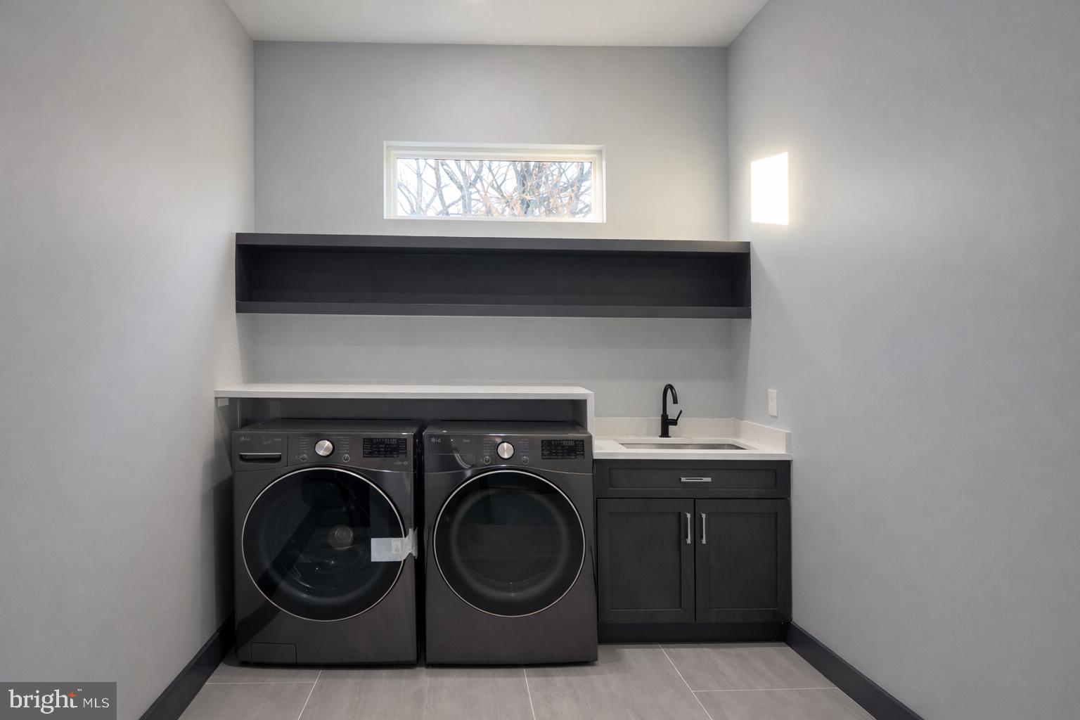 2613 Beacon Hill Road Alexandria, VA 22306 - Photo 40 of 65 Sleek laundry space with modern finishes.