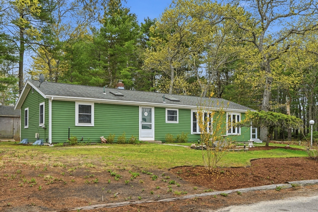 94 Edgewater Drive Wareham, MA 02571 - Photo 2 of 37 a front view of a house with a yard