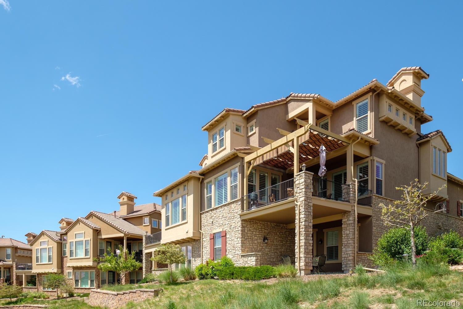 9233 Viaggio Way Highlands Ranch, CO 80126 - Photo 33 of 35 a front view of a building