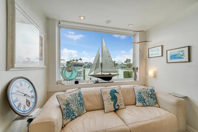 a bedroom with a bed and a large mirror with a chandelier