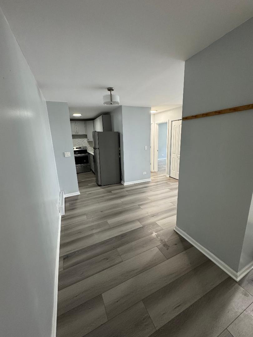 5950 North Kenmore Avenue, Unit 202 Chicago, IL 60660 - Photo 2 of 2 a view of a room with a staircase