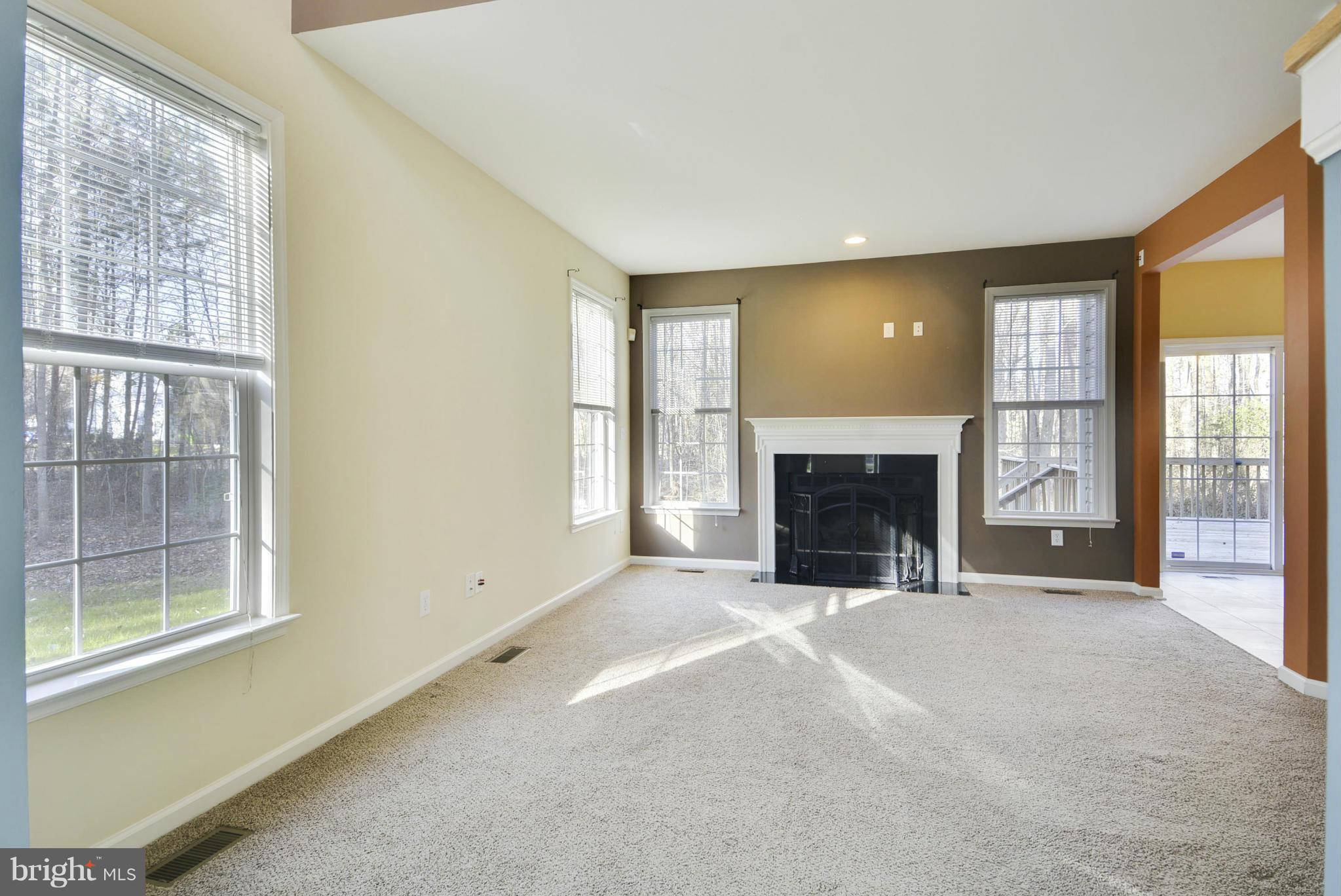 Family Room complete w/ wood burning fireplace