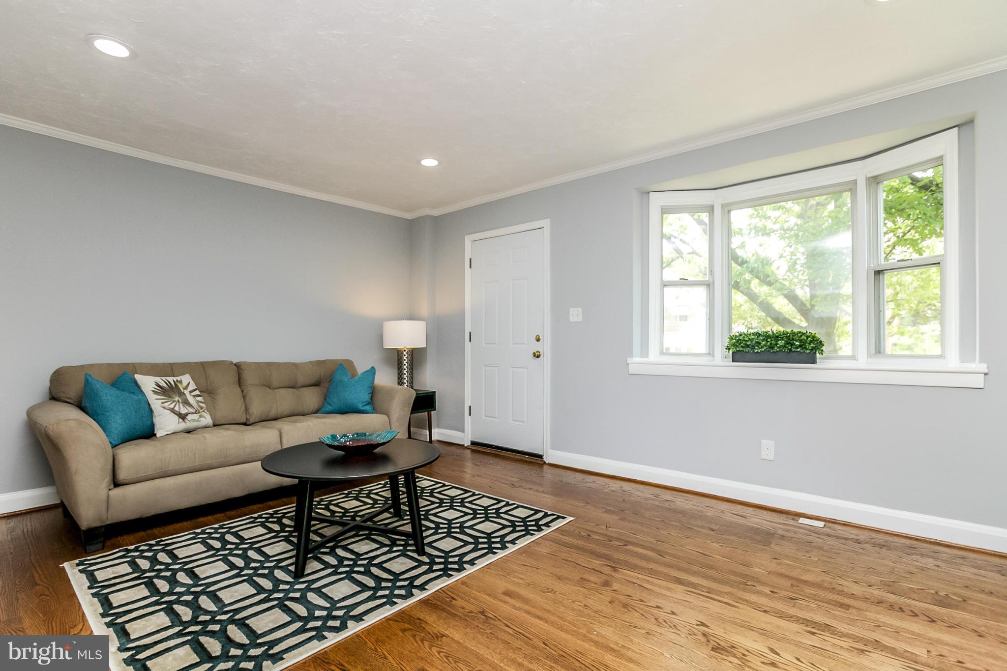 940 Masefield Road Baltimore, MD 21207 - Photo 3 of 28 a living room with furniture and a window