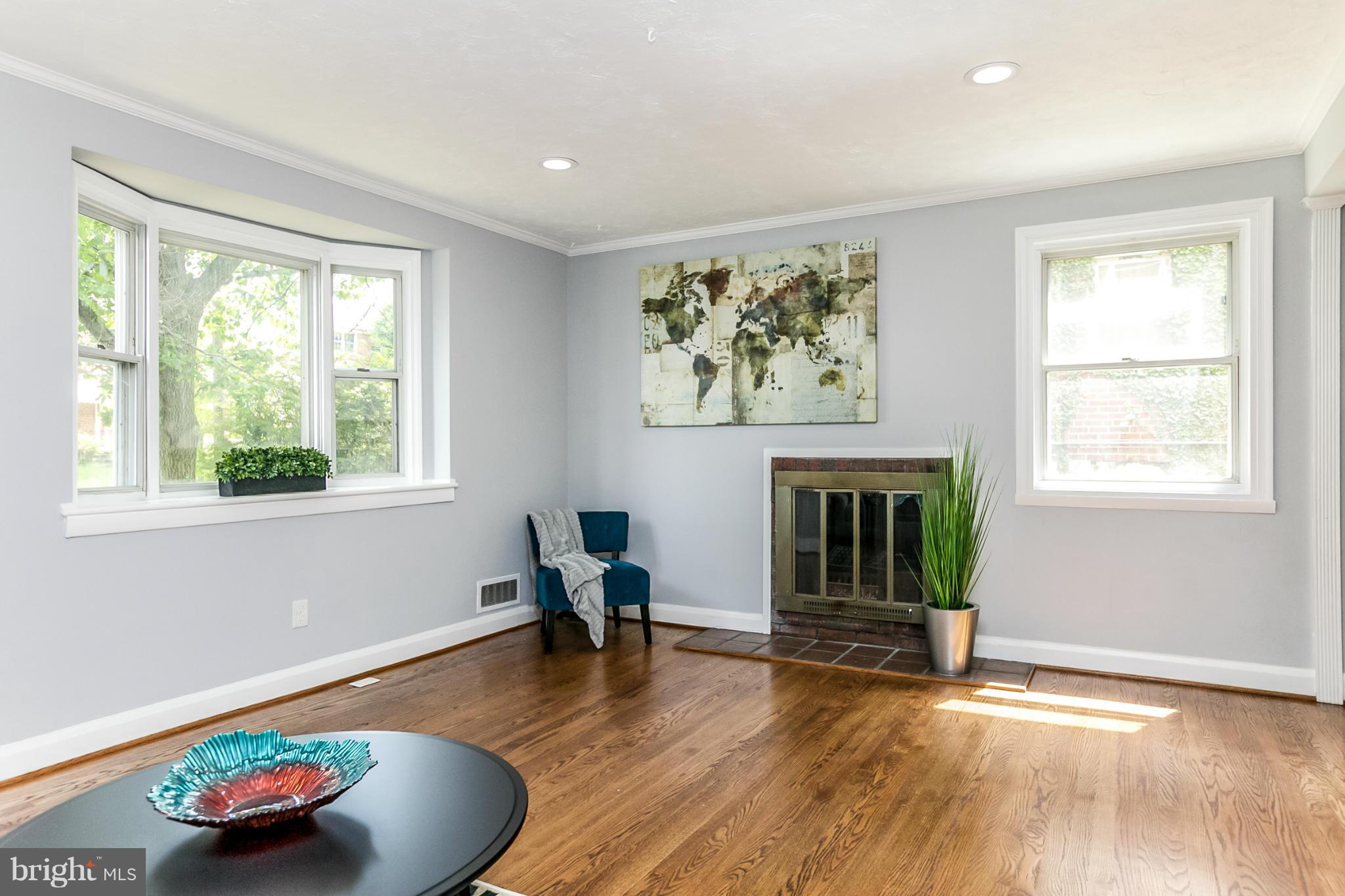 940 Masefield Road Baltimore, MD 21207 - Photo 4 of 28 a living room with furniture and a fireplace