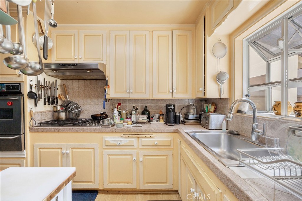 2905 Rindge Lane Redondo Beach, CA 90278 - Photo 20 of 26 a kitchen with stainless steel appliances granite countertop a sink stove and cabinets