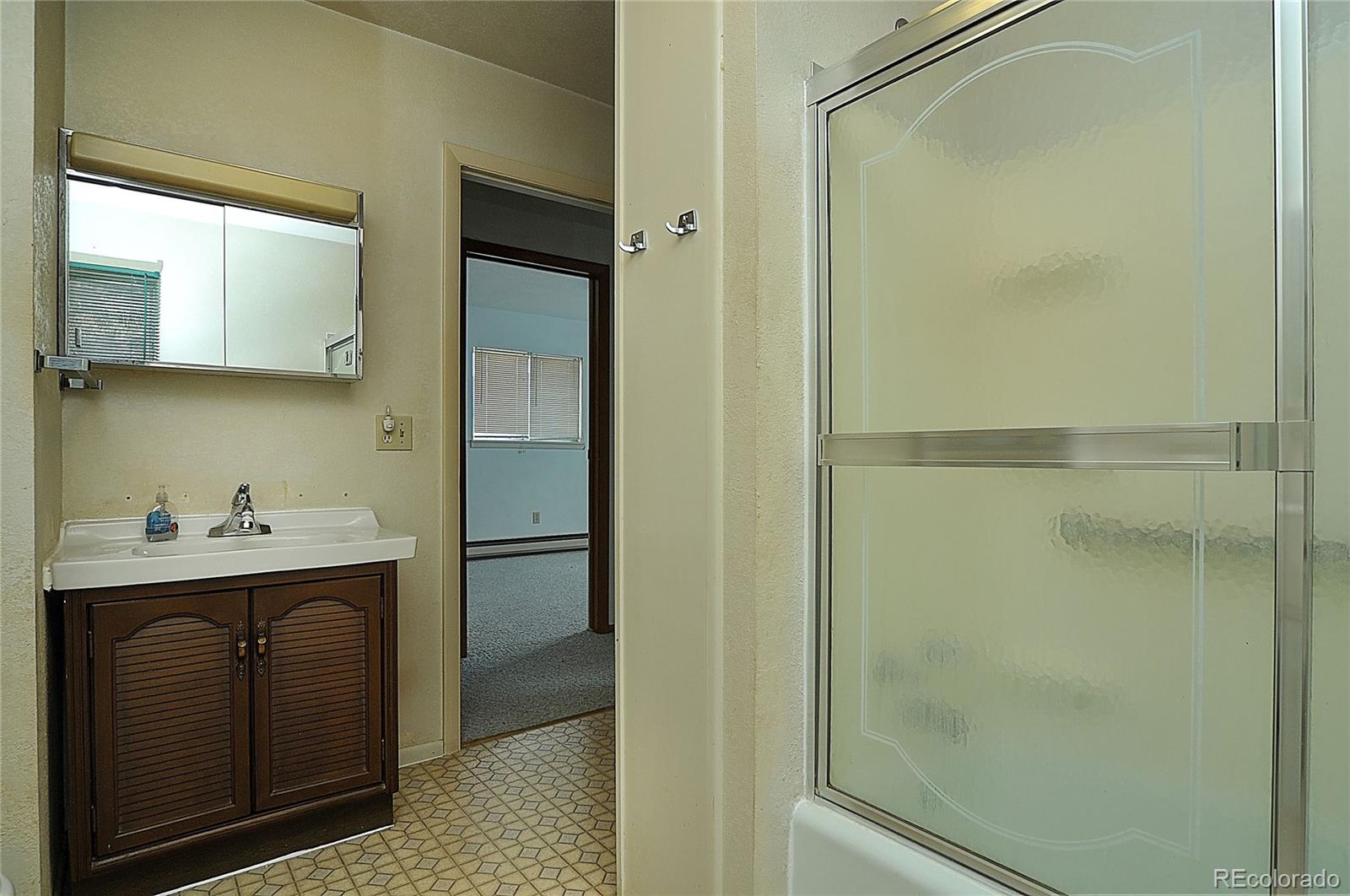 114 Loop Drive Howard, CO 81233 - Photo 19 of 24 a kitchen with a sink and refrigerator
