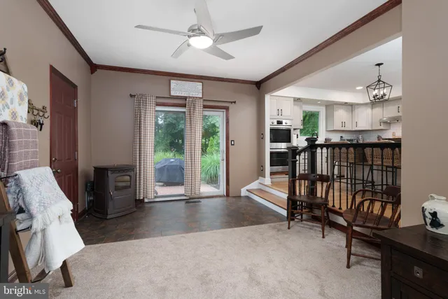 a view of a livingroom with furniture a flat screen tv and outdoor view