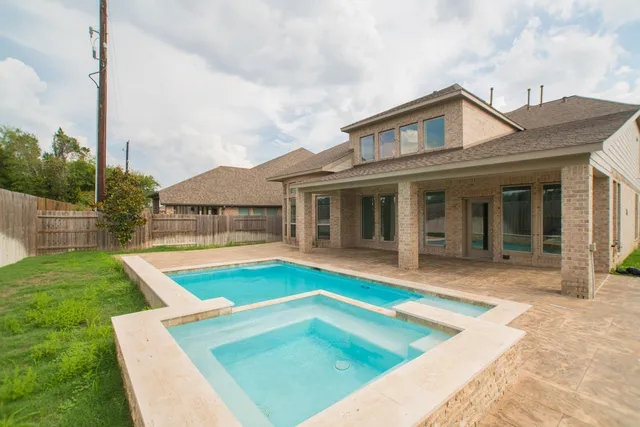 a view of pool with yard